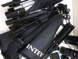 a pile of umbrellas and other items sitting on a table