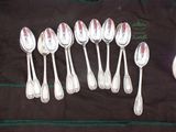 a lot of spoons that are sitting on a table