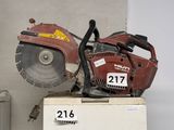 a chainsaw sitting on top of a refrigerator in a room