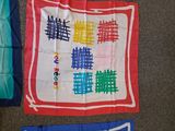several different types of cloths are laid out on the floor