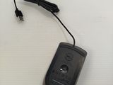 a black mouse with a cord attached to it