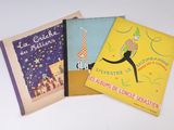 trois livres pour enfants sont alignés sur une surface blanche