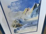 framed watercolor painting of a mountain scene with a blue border
