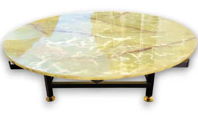 yellow marble coffee table with black legs and a marble top