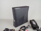 a video game console and a game controller on a table