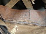 a close up of a brown bag with a brown handle