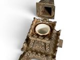 a silver clock with a bell on top of it