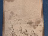 an old picture of a group of people sitting on a beach next to a body of water