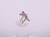 sterling silver ring with pink crystals on a clear glass