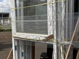 an image of a window being loaded onto a pallet