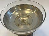 a glass bowl that is sitting on a table