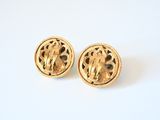 pair of vintage gold tone earrings with filigree design