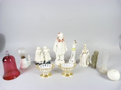 many figurines that are sitting on a white surface