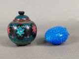 a small blue object next to a small blue object