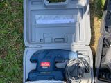 two tools in the case on the grass