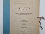 an old book with a blue cover sitting on top of a table