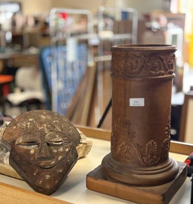 two vases sitting on a table in a store