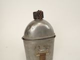 a silver container with a bird on top of it