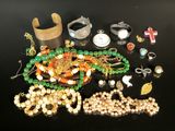 a lot of beads and bracelets on a table