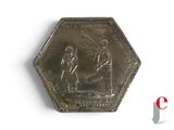 a silver coin with a picture of a man and a woman on it