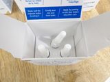 a box of toothpaste sitting on a table with a box of toothpaste next to it