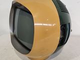 a small television sitting on top of a white table