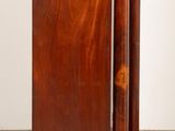 pair of mahogany and brass mounted bedside tables in the manner of person