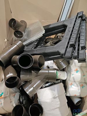 a pile of assorted items in a cardboard box