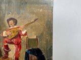 a painting of a man playing a guitar on the wall