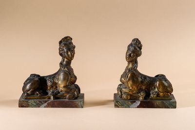 pair of antique bronze figurines of a woman and a dog