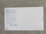 the back of a white box with a white label on it