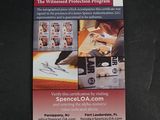 an image of a business card with a picture of a person writing on it