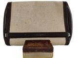 an image of a brown and white purse with a small box