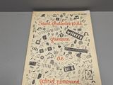un livre posé sur une table, sur lequel figure un dessin