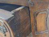 a wooden table with a drawer underneath it