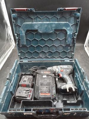 a tool box with a drill and two other tools in it