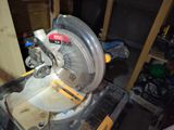 someone is using a circular saw to cut a piece of wood