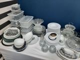 a table with a lot of dishes and dishes on it