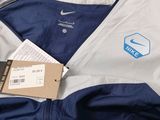 the jacket is blue and white and has a logo on it