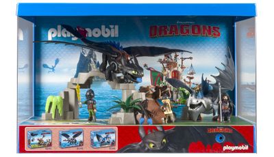coffret de jeu « Dragons » dans une boîte bleue, contenant un dragon et d'autres jouets