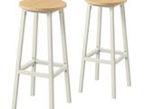 two white stools with wooden tops and legs on a white background
