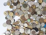 a lot of coins that are on the table