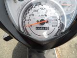 a close up of a speedometer on a motor scooter