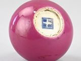 a pink ball with a blue and white design on it