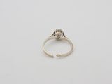 an antique silver ring with a flower design on it