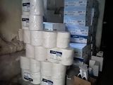 several rolls of toilet paper stacked on top of each other in a room
