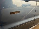 a close up of a car door with a sticker on it