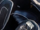 a close up of a black car with leather seats