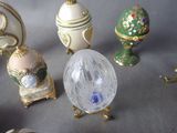many different types of glass eggs on a table