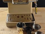 a coffee machine that is sitting on a wooden table